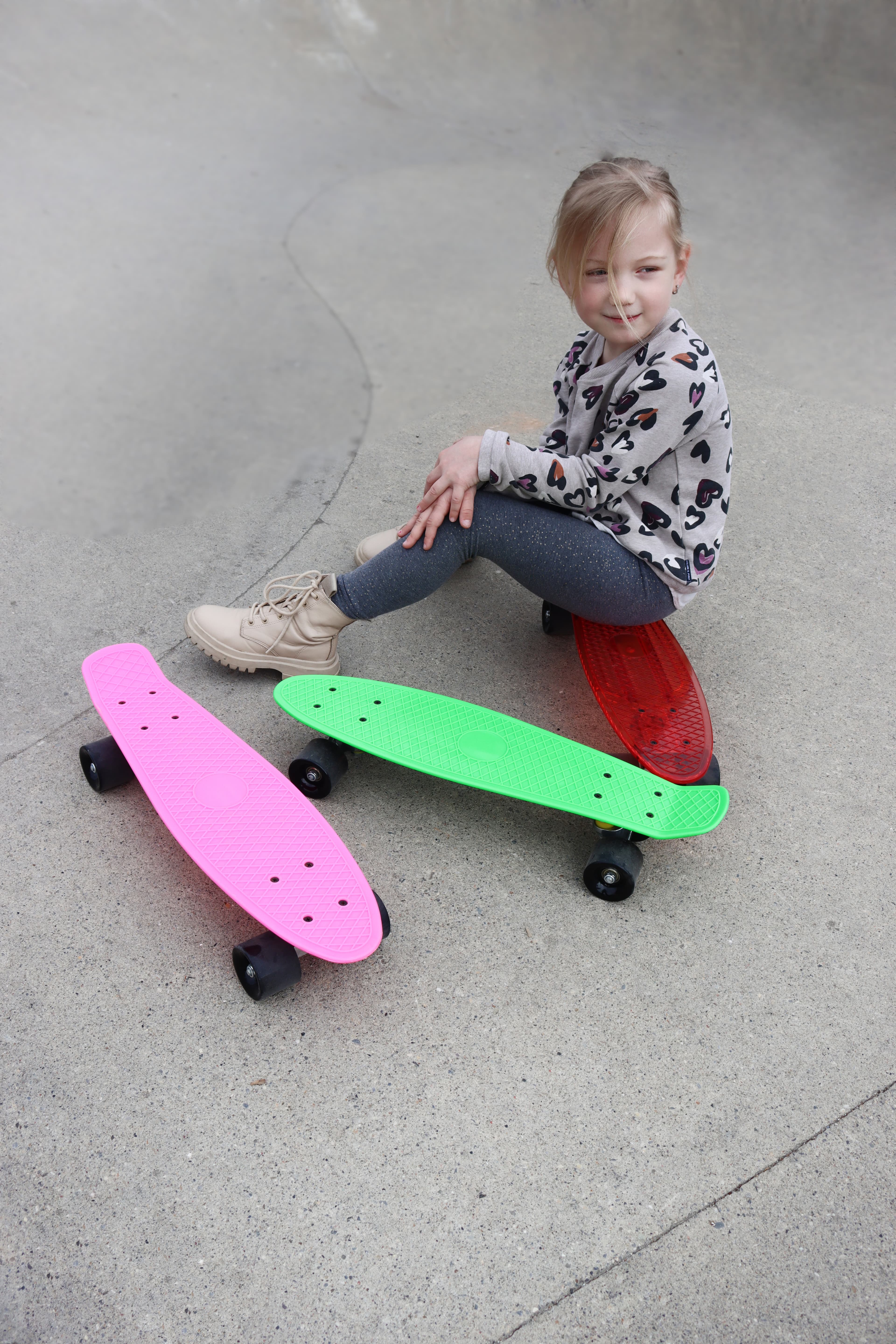 Child with Kobe penny skateboards